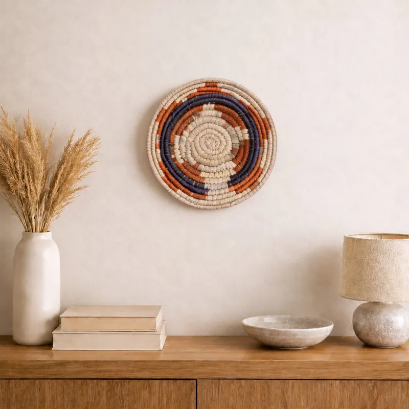 Mini woven wall plate, 12 cm, hanging on a wall in a styled interior