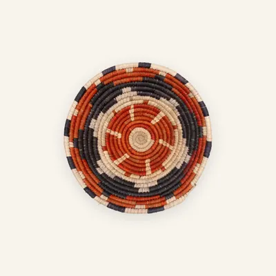Small handwoven wall plate, 23 cm, in orange, black, beige