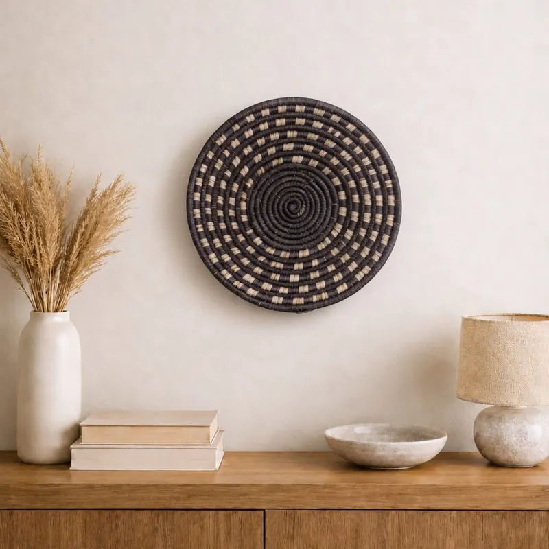 Small woven wall plate, 25 cm, hanging on a wall in a styled interior